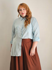 Woman wearing a pair of chocolate coloured wide leg pants and shirt by Hope and Harvest.